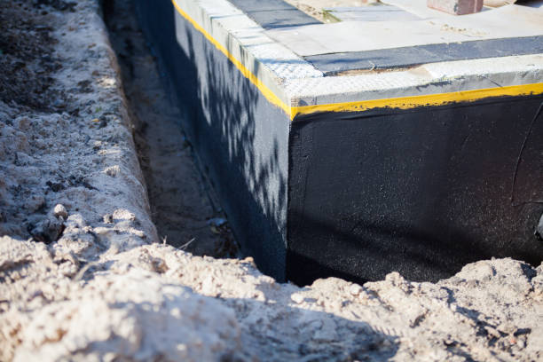 Professional Waterproofing technician working in Roanoke, VA